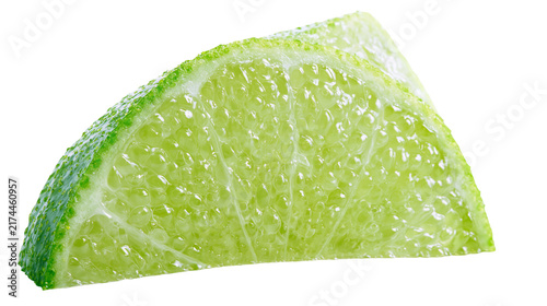 Isolated fresh green lime wedge with juicy pulp and vibrant rind, refreshing citrus fruit