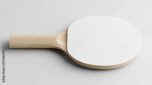 Table Tennis Paddle — A single paddle faces upward, showcasing its rounded playing surface and ergonomic handle in a clean, simple composition.
