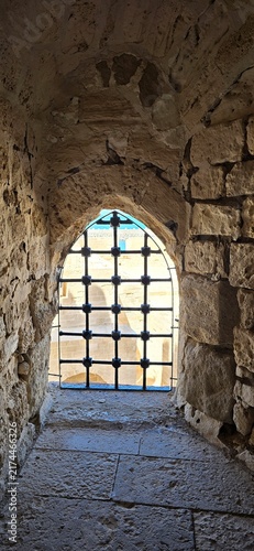 Iron bar window inside the Citadel of Qaitbay, a 15th-century defensive fortress located on the Mediterranean sea coast, on Pharos Island in Alexandria, Egypt. 