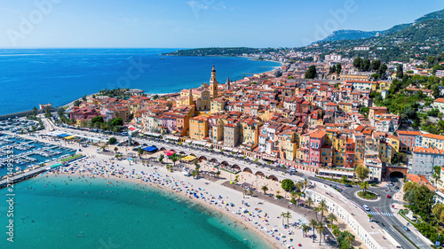 Aerial drone view of the old town of Menton overlooking the Sablettes Beach on the coast of the Mediterranean Sea in the French Riviera