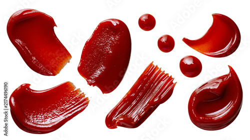 Konstfotografi Isolated set of vibrant red ketchup and tomato sauce drops, splatters, streaks, and smears