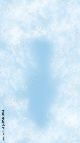 Soft Blue Sky with Wispy White Clouds and Central Copy Space.