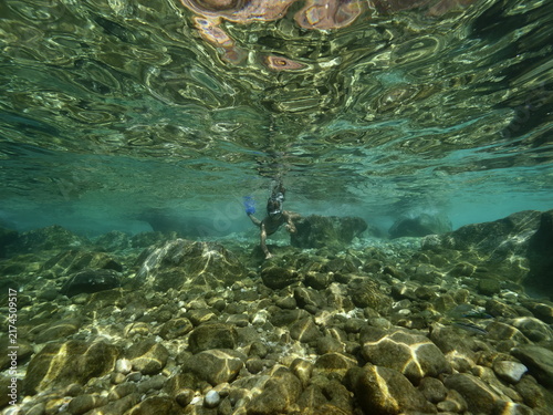 young girl diving underwater enjoying holiday
