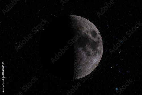 Cuadro en lienzo Detailed half moon illuminated against a deep black sky, creating a minimalist celestial composition with dramatic contrast