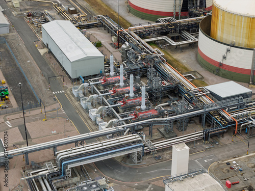 Aerial View of a Liquefied Natural Gas Facility Featuring Large Storage Tanks and Industrial Piping