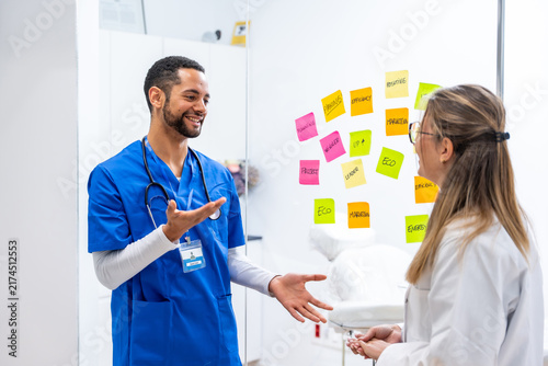 Doctors collaborating on medical concepts strategy in hospital