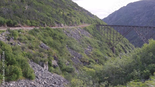 a wide view of abandoned dead horse gulch bridge from the white pass & yukon route railway at alaska of the usa