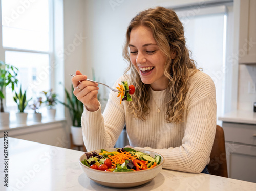 Beautiful young woman eating fresh organic vegetable salad healthy nutrition diet lifestyle
