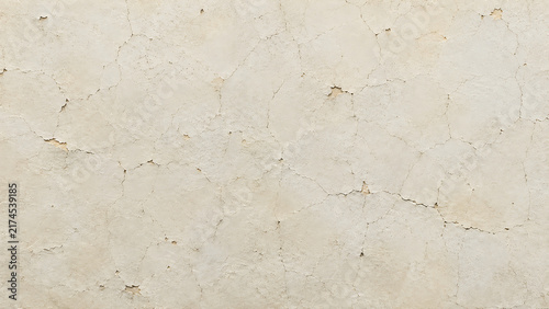 Vintage cracked plaster texture, weathered beige concrete wall background, rustic off-white stone surface for architectural design