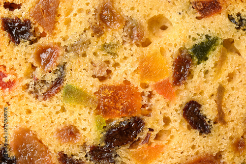 Top view close up texture of traditional Christmas fruitcake with dried fruits