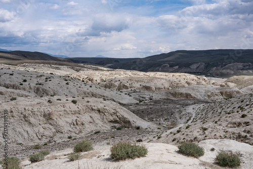 A beautiful hilly steppe landscape with uniform slopes and sparse vegetation.