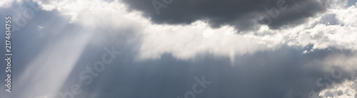Bild auf Leinwand Dramatic sky with dark storm clouds building for ominous weather, Crepuscular Ra