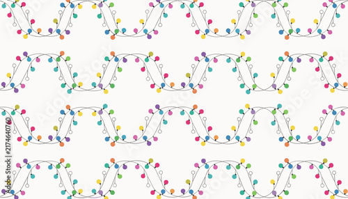 Festive seamless pattern of wavy colorful string lights with glowing bulbs against a clean white background.