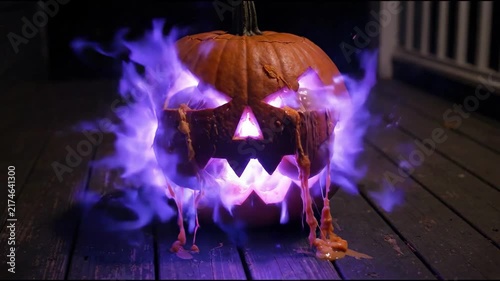 Cinematic 4K Evil Jack-o'-Lantern with Oozing Guts and Erupting Purple Flames on a Dark Porch Seamless Loop