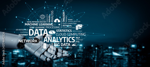 Cuadro en lienzo A striking image of a robotic hand holding words that represent data analytics concepts, set against a city skyline, capturing the essence of technology and innovation