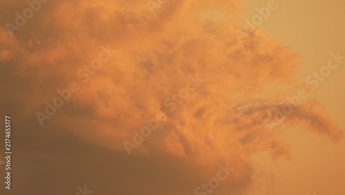 Sunset clouds sky golden hour orange clouds fill the frame during a vibrant evening with copy space