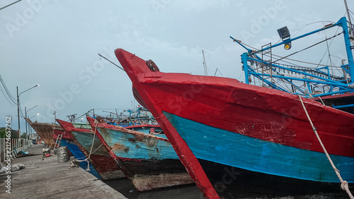 Foto Traditional Wooden Fishing Boats Docked