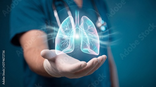 A medical professional holding a glowing digital holographic projection of human lungs in their palm with healthcare provider wearing three dimensional digital wearing scrubs glove glove holds