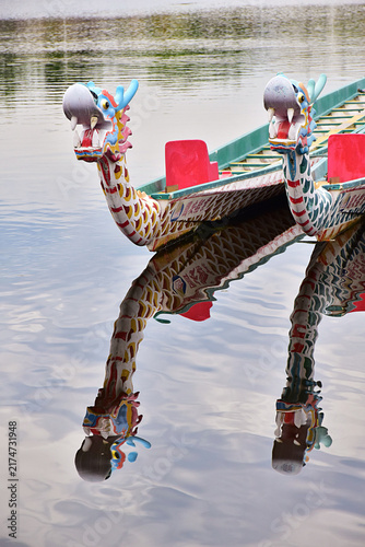 Colorful Dragon Boat Reflected on Calm Water