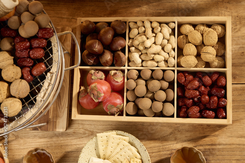 Assorted Dried Fruits and Nuts in a Wooden Box