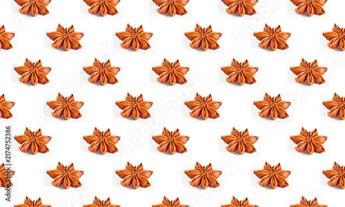 Colorful star anise pattern on a white background, side view.