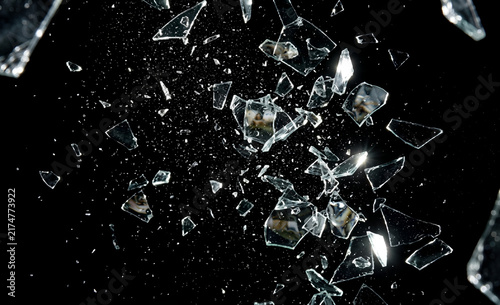 Minimalist shattered glass. Transparent geometric prism explosion with particle debris, broken ice crystal shards on transparent Bg, futuristic 3D render, light scatter, 3D glass shape.