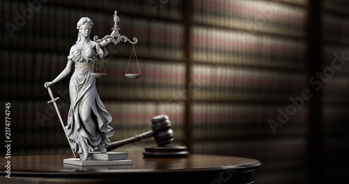 Fotografie Themis Statue and Judge Gavel on Books Background
