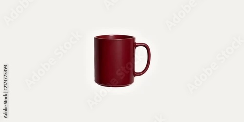 Solid dark red ceramic coffee mug standing upright against a plain background ceramic cup tea mug drinkware kitchenware beverage cup