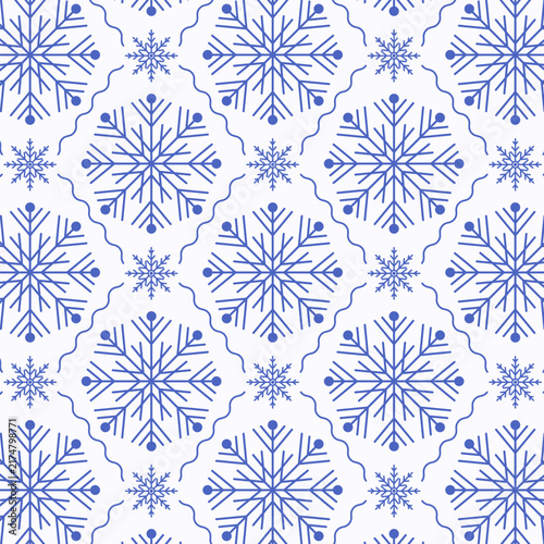 Seamless pattern with blue snowflakes on a white background. Winter festive ornament for Christmas wrapping paper, textile prints, and holiday decor.