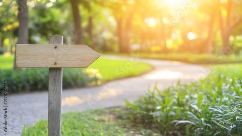 signpost. Wooden signpost near a garden path in a natural outdoor setting, illuminated by soft morning light. travel magazines, destination branding, designed for travel destination branding.