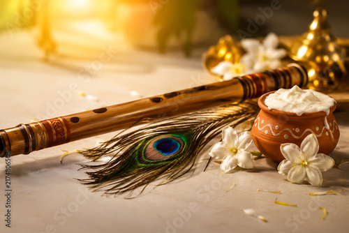 Janmashtami Festival Still Life with Krishna Flute, Peacock Feather, Butter Pot and Jasmine Flowers
