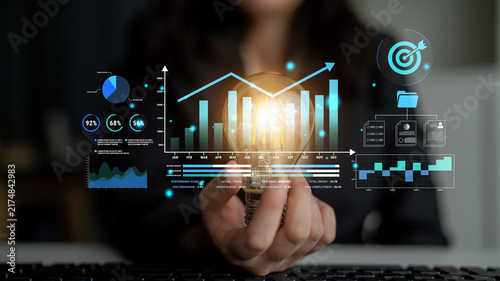 Konstfotografi Business Innovation Concept with Light Bulb, Financial Graphs, and Digital Data Representations for Modern Entrepreneurship and Growth Strategies Haptic