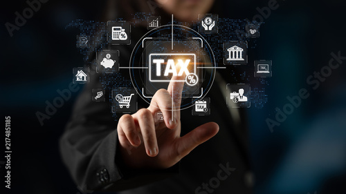 Fotografie Business Professional Interacting with Digital Tax Interface Featuring Various F