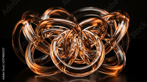 Abstract sculpture with shiny metallic and transparent elements on black background
