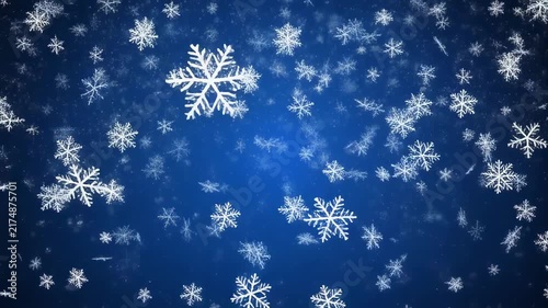 Gentle snowflakes falling against a deep blue gradient with subtle light rays for festive winter celebrations