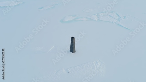 Isolated Tower on Vast Ice Field
