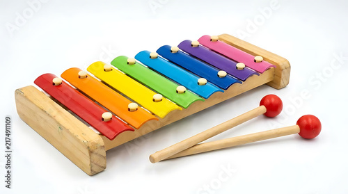 Colorful wooden toy xylophone with mallets on white background.