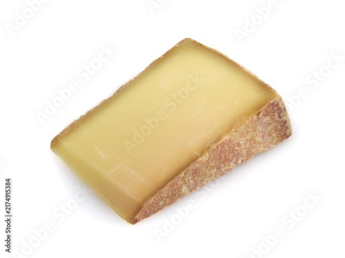 Piece of french beaufort  cheese on white background	.