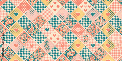 Vintage patchwork quilt pattern featuring diamond shapes with paisley hearts and checks paisley print heart design vintage textile retro fabric pastel colors checkered pattern sewn patches