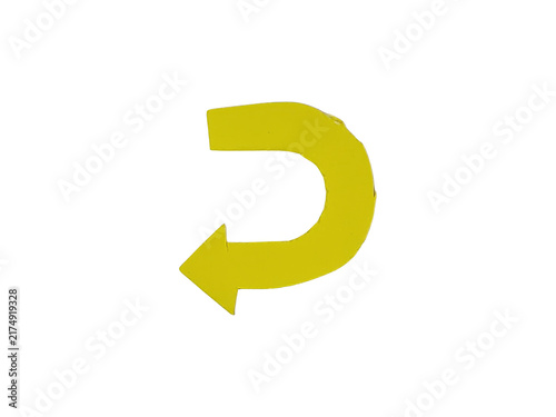 Fotografie A single yellow u-turn arrow pointing left, isolated on a white background, for