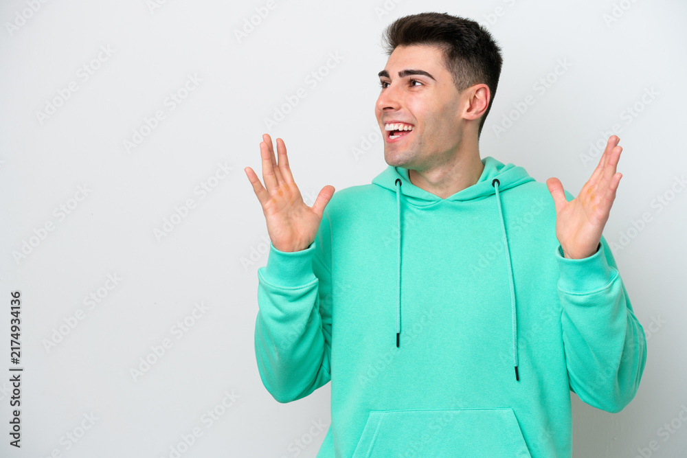 Fototapeta premium Young caucasian man isolated on white background with surprise facial expression