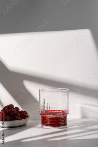 mashed raspberries in a glass