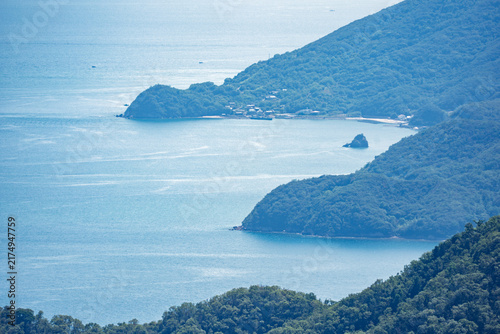 View of calm water in quiet bay on island coast 