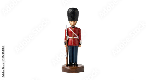 Photography Wooden toy soldier nutcracker figurine in traditional red uniform