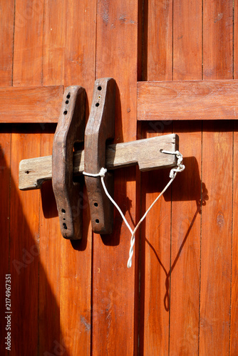 traditional wooden door with latch.traditional folk wisdom in making door locks.