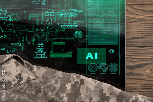 Defense technology concept featuring a military laptop with artificial intelligence analyzing battlefield information, tactical planning and digital command systems.