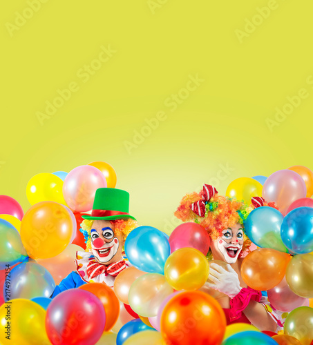 Konstfotografi Funny clowns with balloons, entertainers in a suit and wig, with clown whiteface makeup