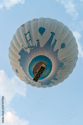 Hot air balloons flying over rocky valley at sunset. Hot air ballooning represents freedom exploration dream.