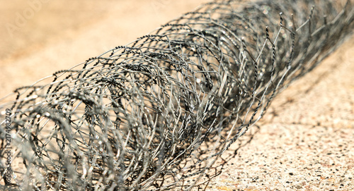 Cuadro en lienzo Close-up of a rolled up chain-link fence, metal wire or wire mesh