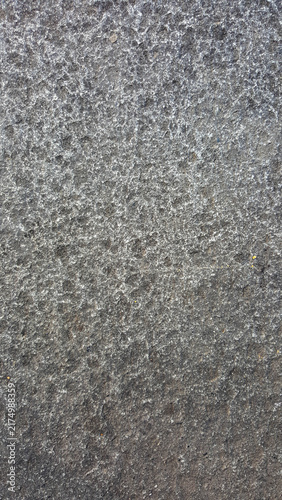 Dark grey slate outdoor stone pavers texture with square tile grid lines and raw basalt surface, ideal for exterior landscape 3D floor material mapping, patio mockups, and architectural background des